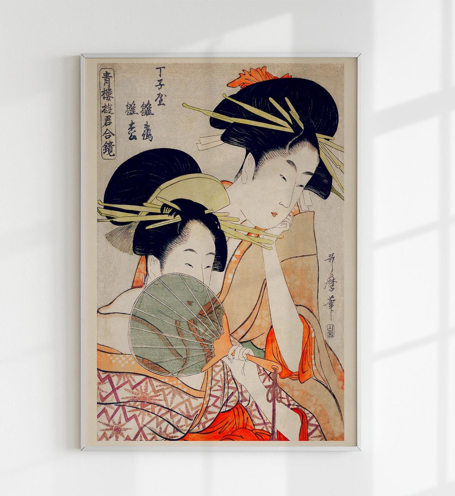 Dos geishas y un abanico verde de Utamaro Kitagawa