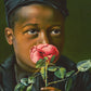 American Beauty - Young boy smelling a rose